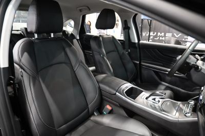 Black leather seats and modern center console in luxury vehicle interior