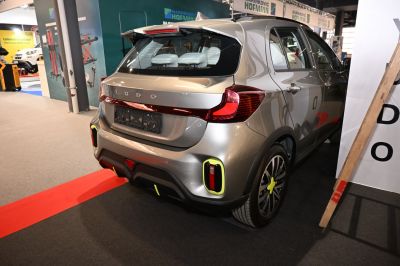 Rear view with distinct tail lights and hatchback design