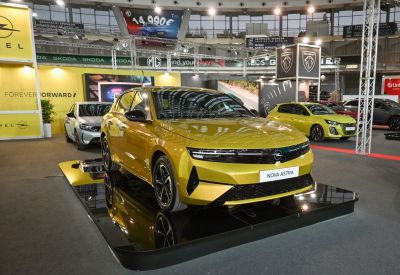 Front view of a 2026 hatchback with LED headlights and sleek grille