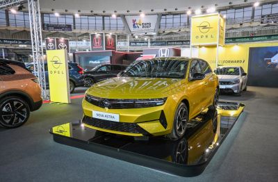 Yellow hatchback with LED headlights and dynamic front grille