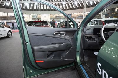 Interior door panel with controls and dashboard steering wheel details