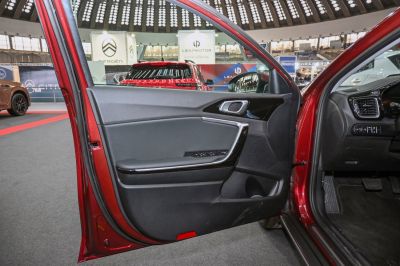Car door interior panel with ergonomic controls and modern design