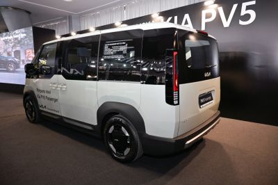 Rear-side view of futuristic minivan with sliding door