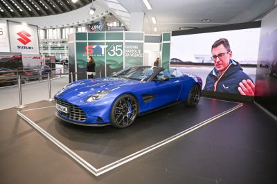 Blue convertible with aerodynamic vents and alloy wheels.
