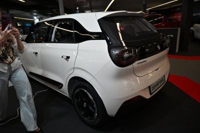 Rear and side view of a compact hatchback with black roof accents and modern taillights