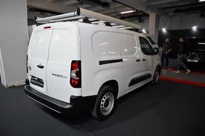 White L2 4 door van with rooftop rack