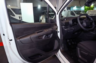 Interior driver door panel and dashboard with steering wheel and controls