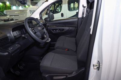 Front cabin with steering wheel and fabric seats
