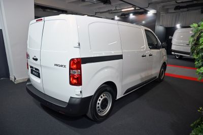 Rear and side view of a white L2 4 door cargo van with solid panel doors and taillights