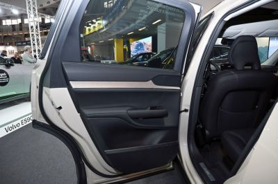Rear door panel with premium materials and ergonomic handle