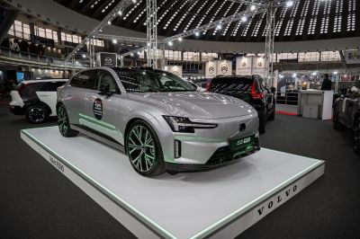 Electric luxury sedan with sleek headlights and aerodynamic body design