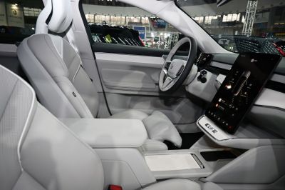 Premium light leather seats with large vertical touchscreen display