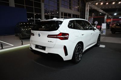 Rear view of white SUV with modern LED tail lights and aerodynamic design