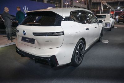 Rear view of electric SUV with slender taillights and black roof