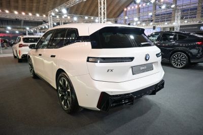 Rear view of BMW iX with updated rear lights and sleek facelift design