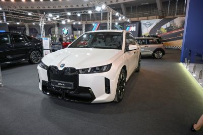 Front view with sleek headlights and distinctive large grill