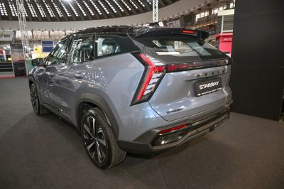 Rear view of a modern SUV with unique vertical tail lights and glossy finish