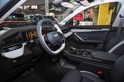 Modern digital dashboard and stylish steering wheel with advanced controls