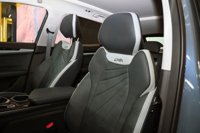 Black and white perforated seats with EMA logo and detailed stitching
