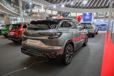 Rear styling and tail lights of modern SUV in showroom