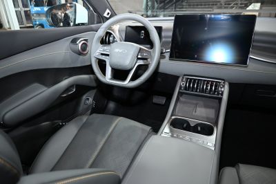Modern car interior with digital dashboard and large touchscreen