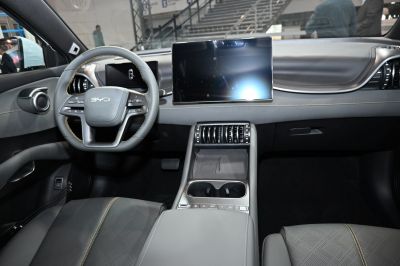 Modern dashboard and steering wheel with large digital displays and sleek center console
