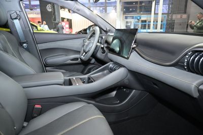 Modern dashboard with large touchscreen and luxury seats