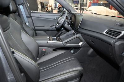 Premium car interior with large touchscreen and stylish seats