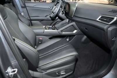 Premium front seats and modern dashboard with touchscreen.