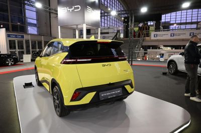 Rear view of a compact electric hatchback with distinctive taillights and sporty design.