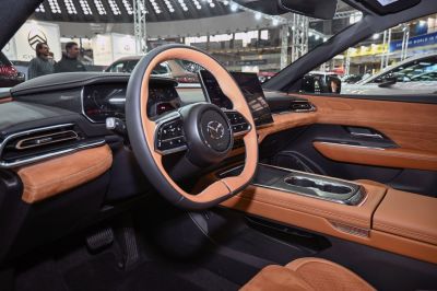 Leather-wrapped steering wheel and digital instrument with center touchscreen