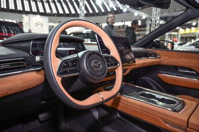 Modern steering wheel, digital dashboard, premium brown leather interior
