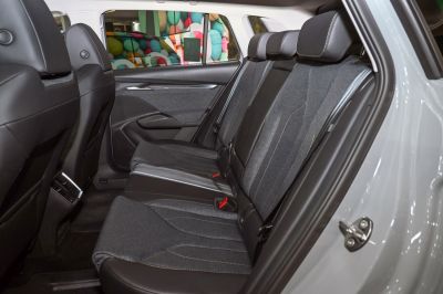 Spacious rear seat interior with cloth and leather upholstery.