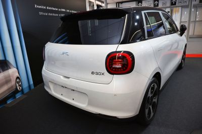 Rear view of a compact hatchback with distinctive tail lights and black roof