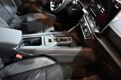 Modern interior with a sleek gear shifter and premium seats