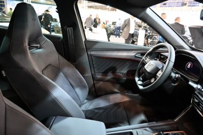 Sporty leather seat and modern steering wheel inside vehicle interior