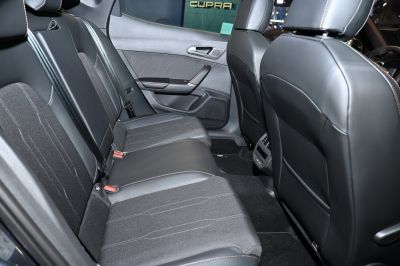 Rear seat interior with mixed upholstery and detailed stitching