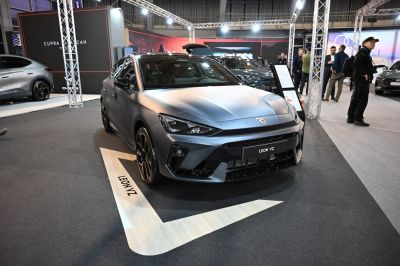 Sporty hatchback front with sharp headlights and dark stylish wheels