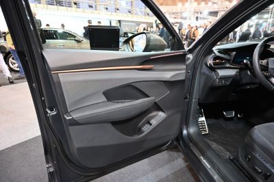 Interior door panel with ambient lighting and modern dashboard layout