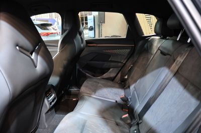 Modern rear seat interior with spacious design and ambient lighting