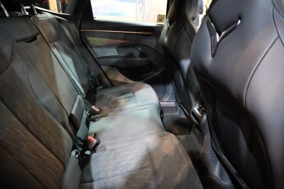 Rear seat interior with leather upholstery and ambient lighting