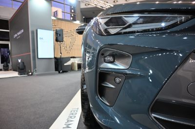 Close-up of SUV headlight and front sensor area