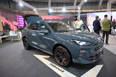 SUV with futuristic front headlights and open rear hatch