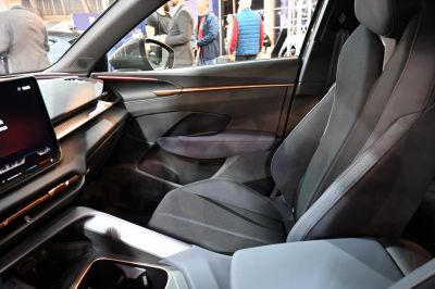 Modern passenger seat and sleek dashboard with infotainment screen