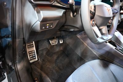 Foot pedals and steering wheel details in vehicle interior