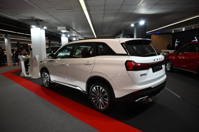Rear side view of white SUV with modern taillights and alloy wheels