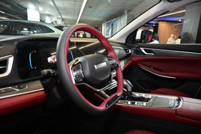 Steering wheel and digital dashboard with red leather interior