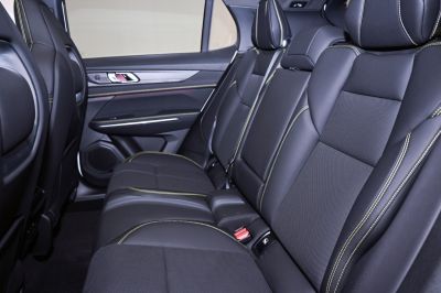 Rear passenger seating with black leather and contrast stitching