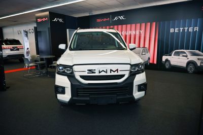 Front view of SUV with bold grille and LED headlights