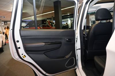 Rear door interior panel with handle, storage, and speaker